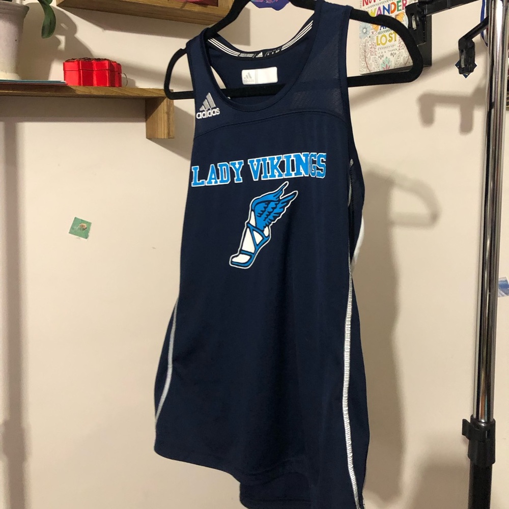 Slightly worn track jersey. SIZE: Small